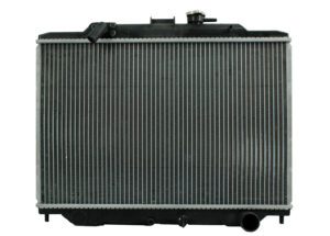 Radiador Automotriz Nissan Urban T/M 02-08 32mm Tubo Soldado Tomas Cruzadas